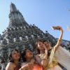 Vietnamese tourists dressed in traditional Thai costumes take a selfie at Wat Arun temple ahead of the Chinese Lunar New Year in Bangkok, Thailand January 18, 2023. REUTERS/Chalinee Thirasupa